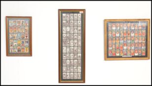 A group of three framed and glazed football related cigarette card sets to include a black and white
