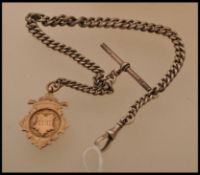 A silver hallmarked pocket watch albert chain being hallmarked with date letter U, T-Bar and lobster