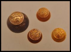 A group of four 18ct gold collar stud buttons having foliate designs. Total weight 4.7 grams
