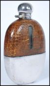 A vintage 20th century silver plated and crocodile skin hop flask of larger form. The oval glass