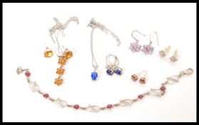 A selection of silver jewellery to include a matching pair of stamped 925 silver earrings set with