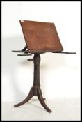 A 19th century Victorian mahogany reading lecturn stand. Raised on splayed legs with turned column