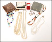 A selection of vintage costume jewellery and boxes to include a multicoloured agate necklace, a