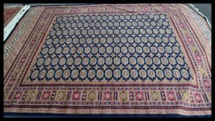 A large  vintage Persian floor carpet Bokhara rug