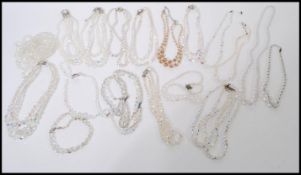 A large collection of vintage costume jewellery strung crystal necklaces of varying lengths, many