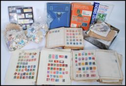 A large collection of vintage 20th century and 19th century stamps to include Victorian examples