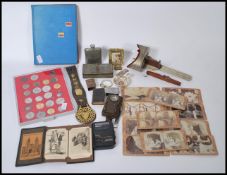 A group of vintage items to include to include horse brasses, coins, trench art etc. Needle case
