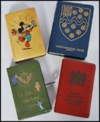A group of four vintage 20th century money boxes / banks to include Disney Mickey Mouse, Post
