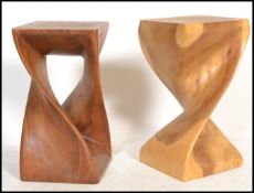 A pair of retro 20th Century solid hard wood carved turned stands / stools, raised on a square