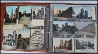 An album of approximately 150 vintage postcards dating from the early 20th century to include mostly