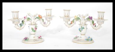 A pair of Dresden porcelain double sconce candelab