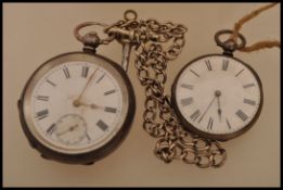 A Victorian 19th century silver hallmarked open faced pocket watch having roman numeral chapter ring