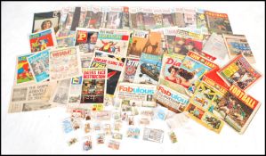 A large collection of vintage football magazines together with a good collection of cigarette