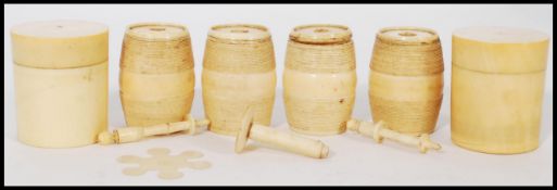 A group of six 19th century ivory sewing thread bobbins in the form of barrels. Average size