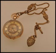 A 14ct gold open faced 19th Century Continental ladies pocket watch, chase decorated face with Roman