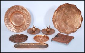 A collection of vintage early 20th Century Arts and Crafts copper dishes / trays in the manner of