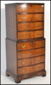 A good quality 20th Century Regency revival flame mahogany bow front tallboy chest of drawers.