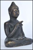 A 19th century Chinese bronze statue figure of a Buddha modelled in the Lotus position. Measures