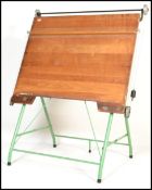 A vintage retro 20th Century draughtmans table makers badge to the very having an adjustable metal