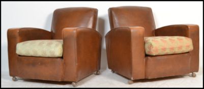 A pair of vintage 20th century Art Deco club armchairs having a faux leather type rexxine