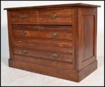 An Edwardian mahogany cottage chest of drawers being raised on a plinth base with 2 short over 2