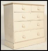 A Victorian painted pine country 2 over 3 chest of drawers. Raised on a plinth base with 2 short