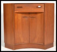 A 1970's G-Plan syle concave teak wood corner desk