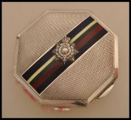 A mid 20th century silver compact of octagonal form bearing a Gibraltar Royal Marines Light Infantry