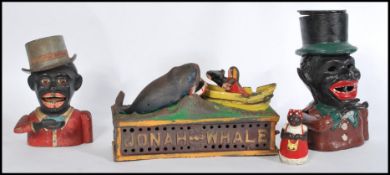 A collection of three vintage style cast metal money boxes to include Jonah and The Whale together