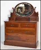 An early 20th century Edwardian mahogany inlaid dressing table chest of drawers having a oval mirror