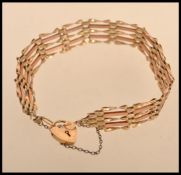 A hallmarked 9ct gold heart padlock bracelet. Weighs 5.9 grams.