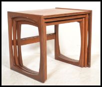 A G-Plan retro teak wood 1970's graduating nest of tables in the Quadrille pattern. The tables