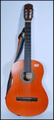 A vintage 20th century Epiphone Spanish acoustic guitar model C25 having shaped hollow body with