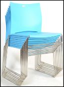 A set of eight contemporary stacking dining chairs, moulded seat pads and back rests in one section,