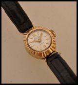 A 20th Century ladies Aviva 9ct gold cased cocktail watch having baton markings to the chapter