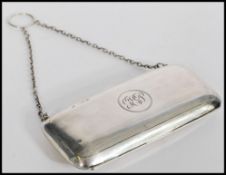 A hallmarked silver early 20th century purse having an engine turned design. Hallmarked for