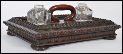A 19th century Victorian desk writing stand / tidy having two glass ink pots with handle to the