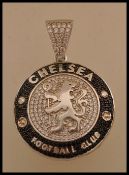 A Chelsea Football Club silver white metal pendant of round form with lion crest to the centre set