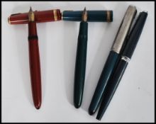A collection of four vintage 20th Century Parker Fountain / Ink pens to include a Parker Duofold