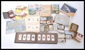 A collection of vintage 20th century cigarette cards loose and in albums to include Wills, John