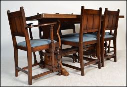 A large Ercol solid oak refectory extending dining table together with a matching set of 6 dining