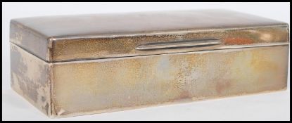 An early 20th century Edwardian George V silver hallmarked table cigarette box with a pine lining