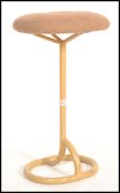 A vintage retro 20th century machinist stool raised on tubular base and supports with button