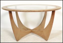 A vintage 20th century G-Plan E Gomme teak circular coffee table in the Astro pattern having inset