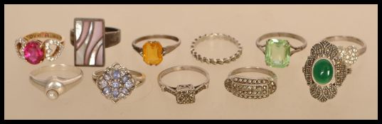 A group of eleven sterling silver 925 rings to include mother of pearl set, coloured stone set,