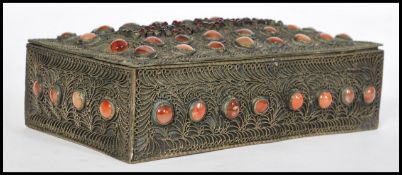 An early 20th century Anglo Indian filigree agate and red stone jewellery casket box having a hinged