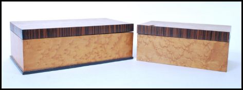 A pair of 20th century satin birds eye maple crossbanded jewellery boxes being of rectangular form