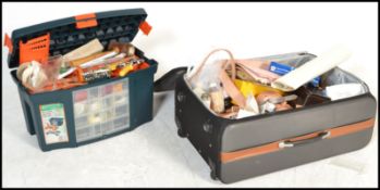 A good collection of leather working tools to include three trays of leather stamps of various