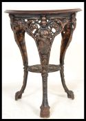 A vintage commemorative cast iron Britannia pub table with solid wood top. The table for The Royal