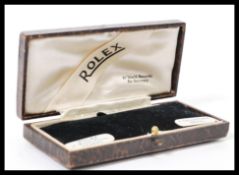 A vintage 20th century Rolex watch box having a leatherette covering with gilt tooled decoration.